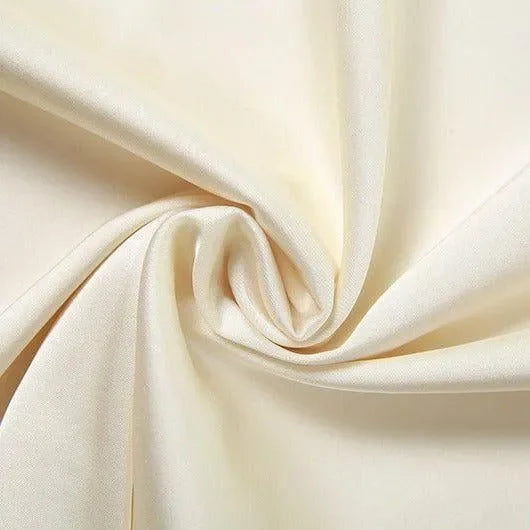 Cream satin fabric with a smooth texture.