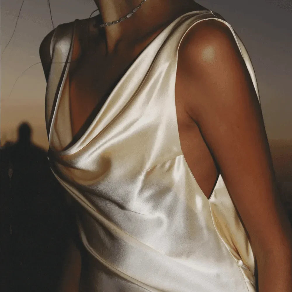 Elegant satin evening dress with draped neckline.