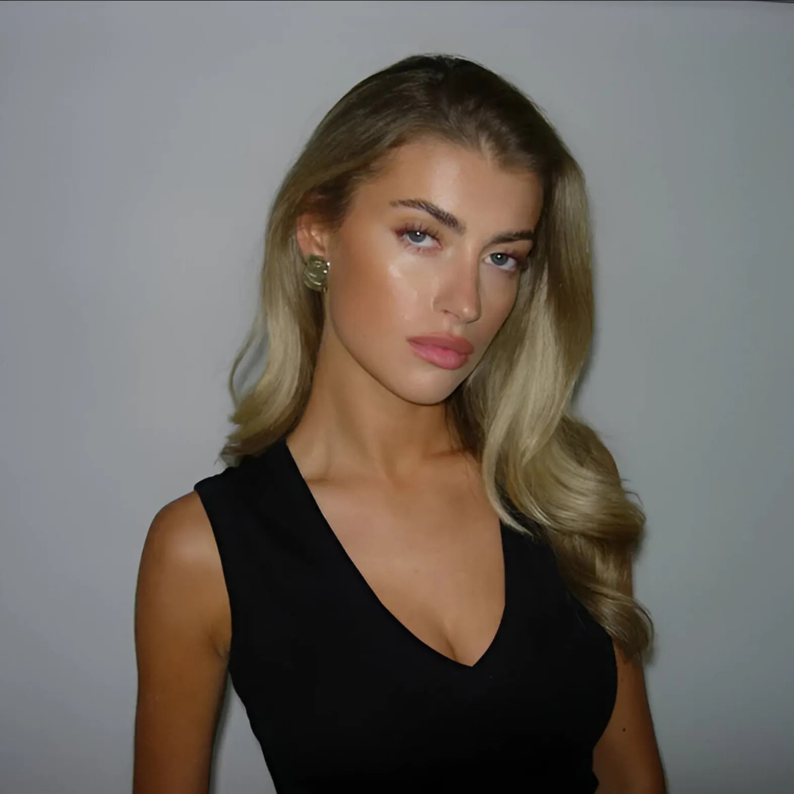 black sleeveless V-neck top