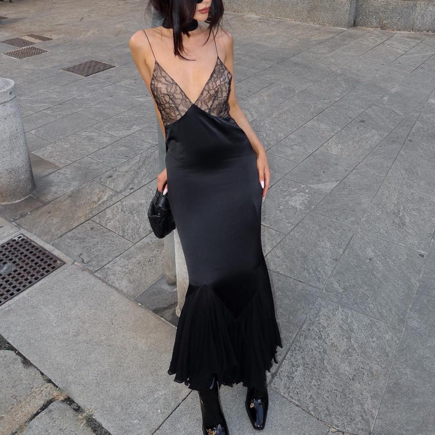 Black satin dress with lace top, ideal for an evening look.