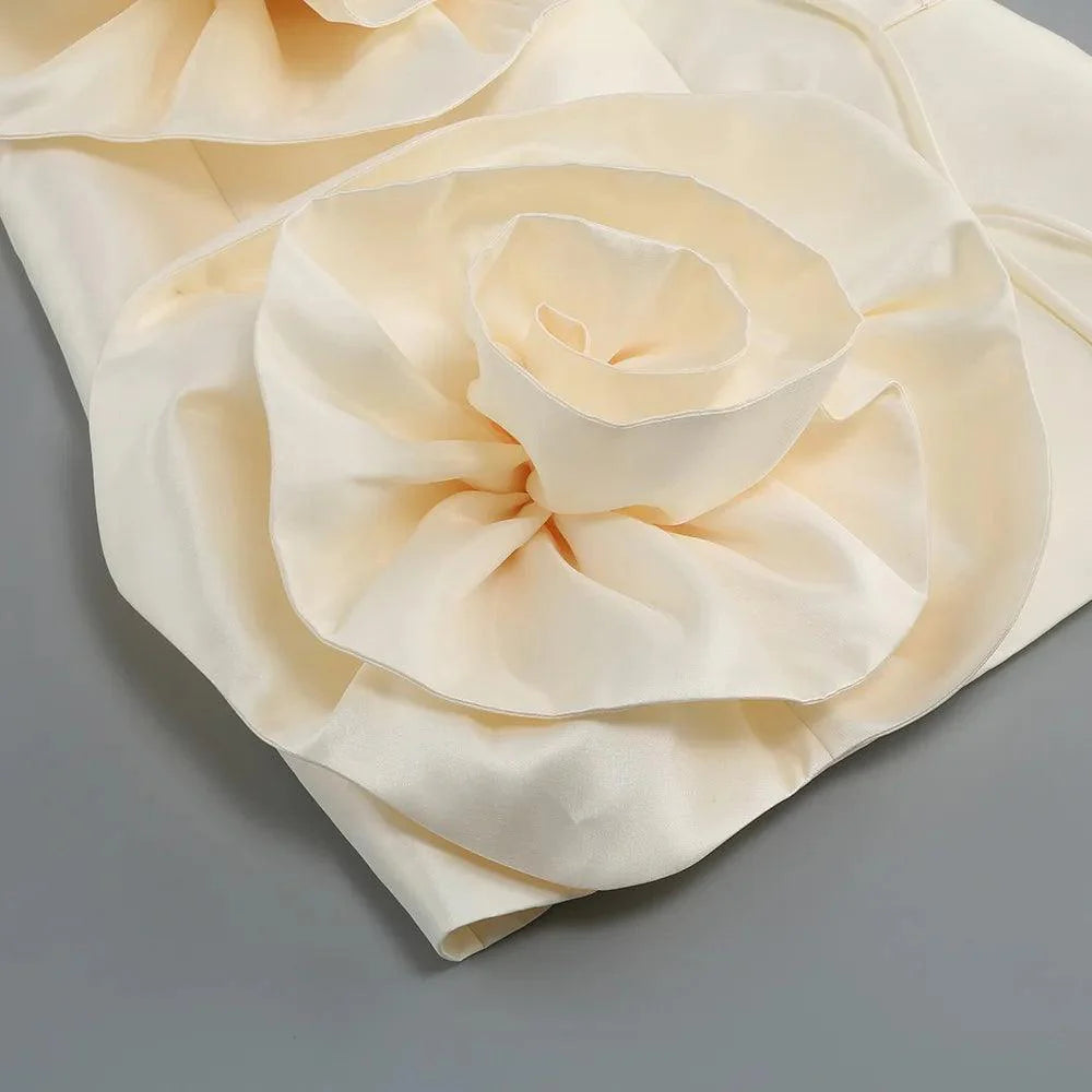 cream satin dress with floral applique detail