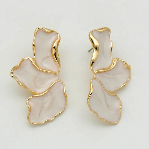 gold-trimmed petal earrings with soft pink detail