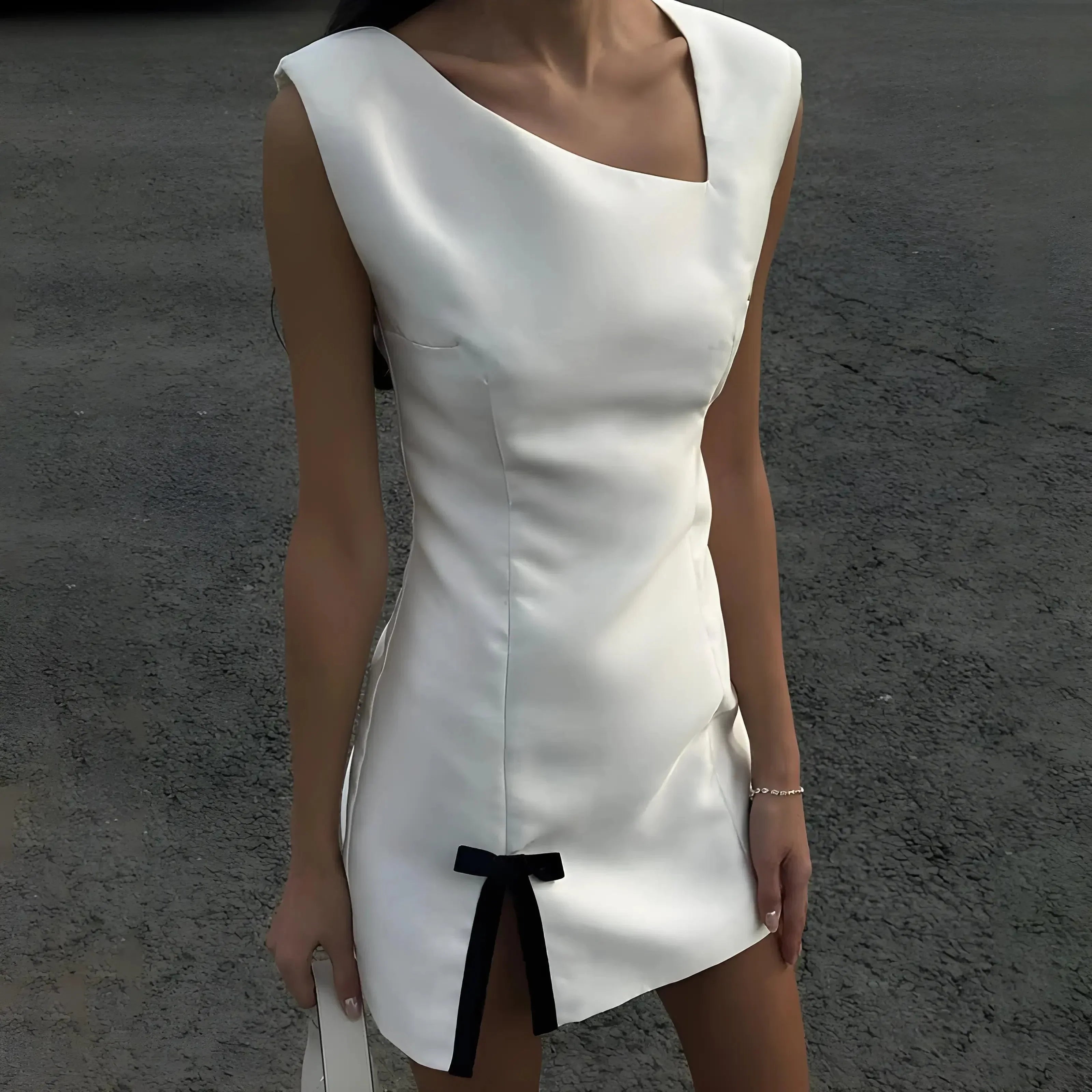 asymmetrical satin mini dress with black bow detail, evening look