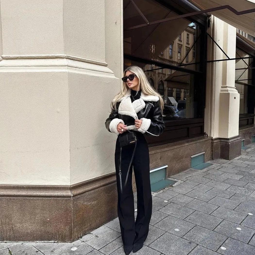 faux shearling-lined leather jacket with wide-leg pants, chic streetwear style