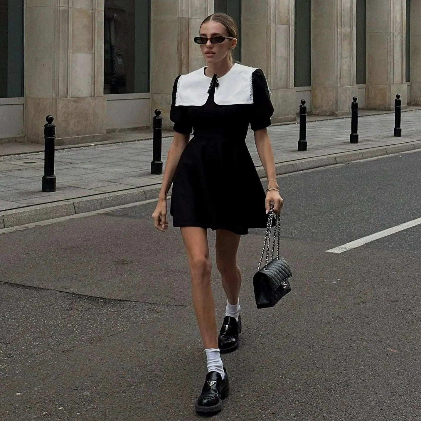 black dress with white collar and puff sleeves, daytime chic look