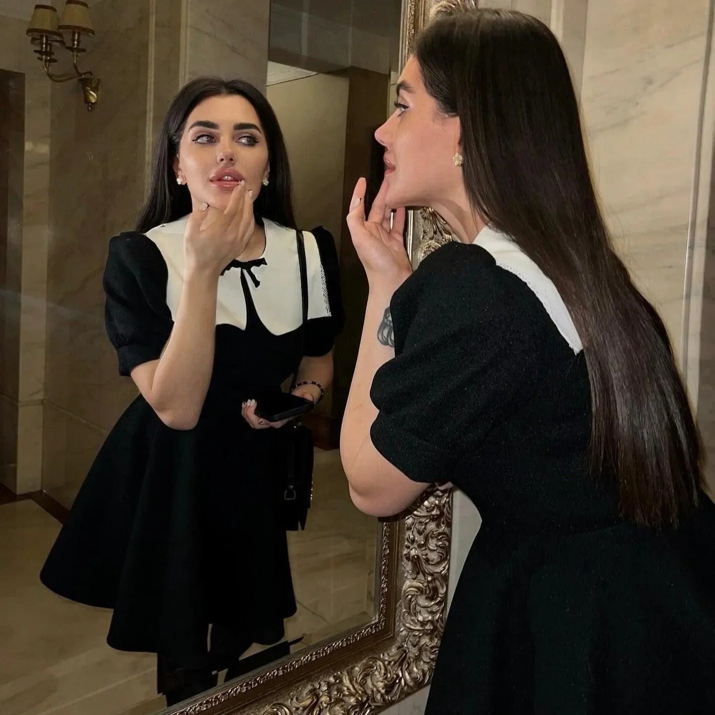 black dress with white contrast collar and puff sleeves