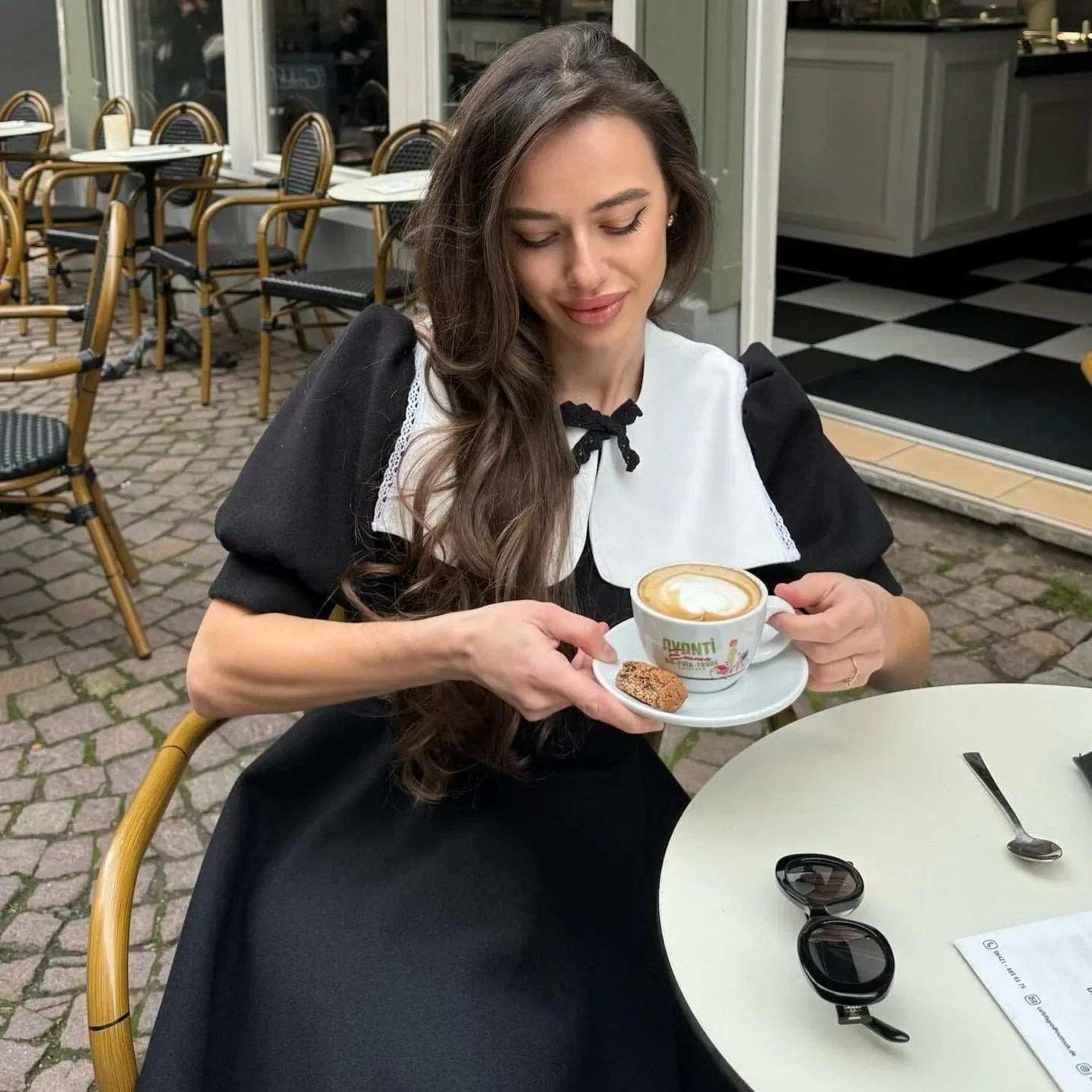 black dress with white collar and puff sleeves