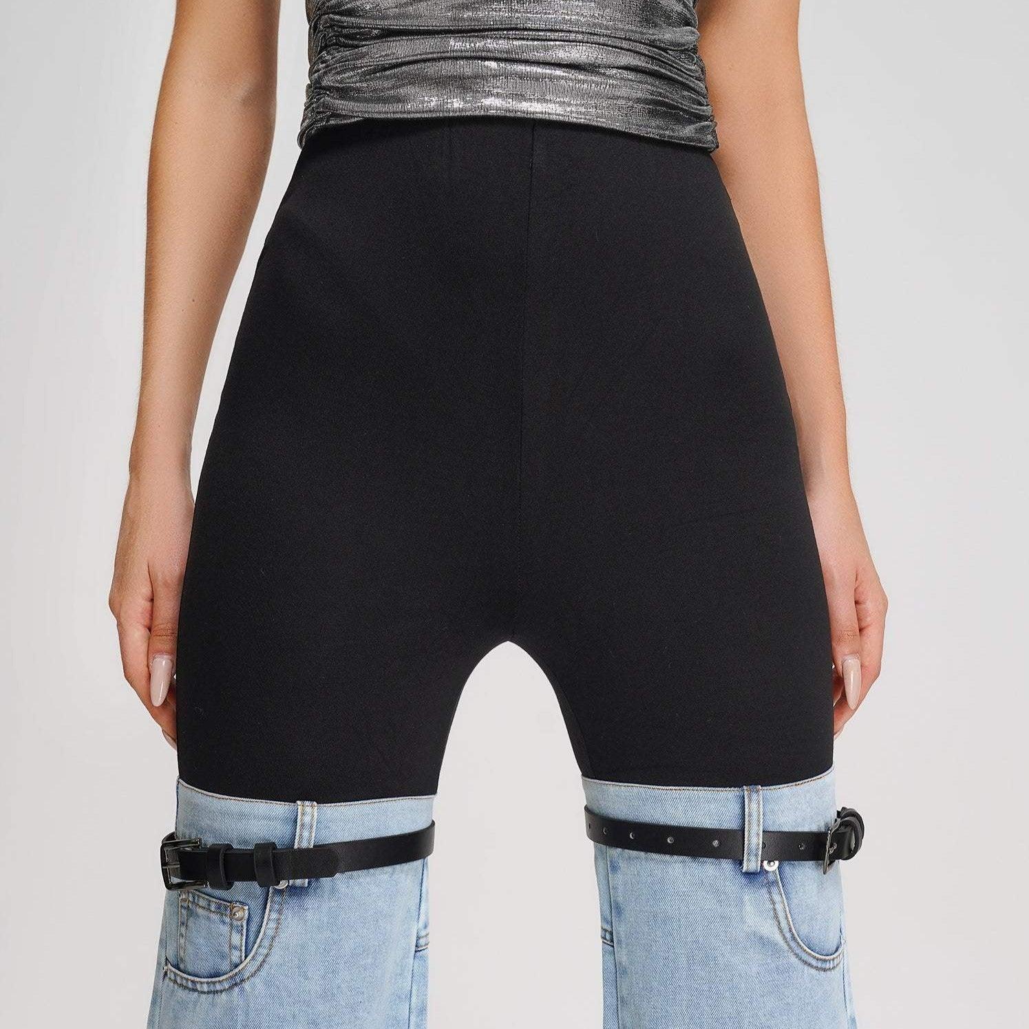 Denim chaps with black high-waisted shorts and metallic silver top.