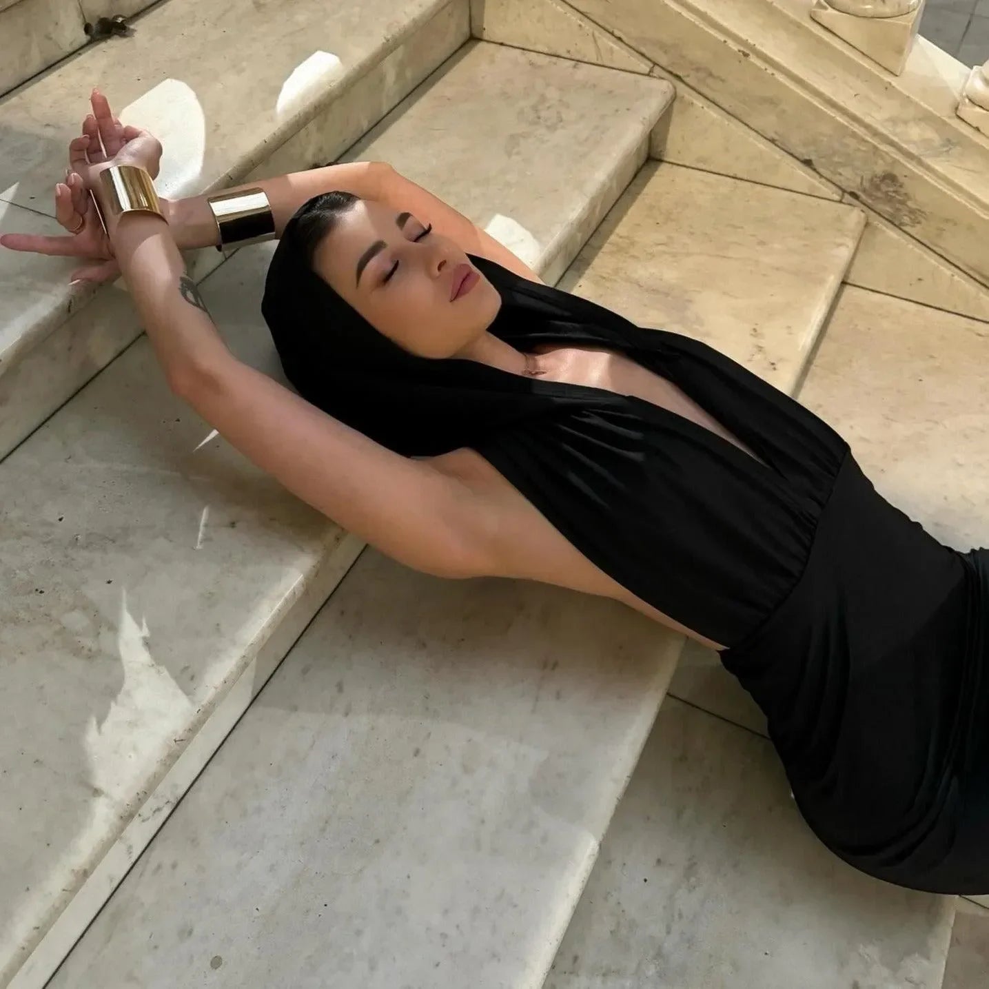 black deep-plunge backless dress, evening look