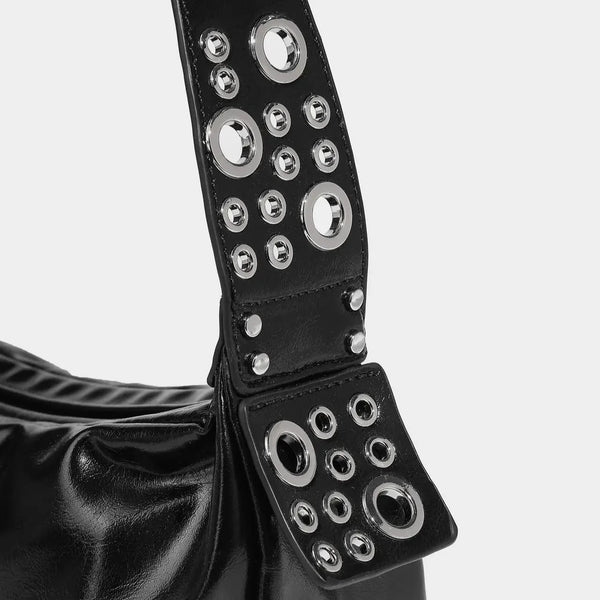 black leather bag with metal eyelets and studs, edgy accessory