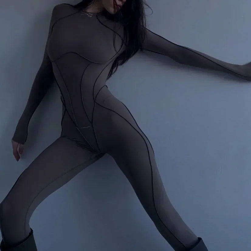 Chic brown open back jumpsuit with form-fitting design and long sleeves, perfect for layering or standalone wear.