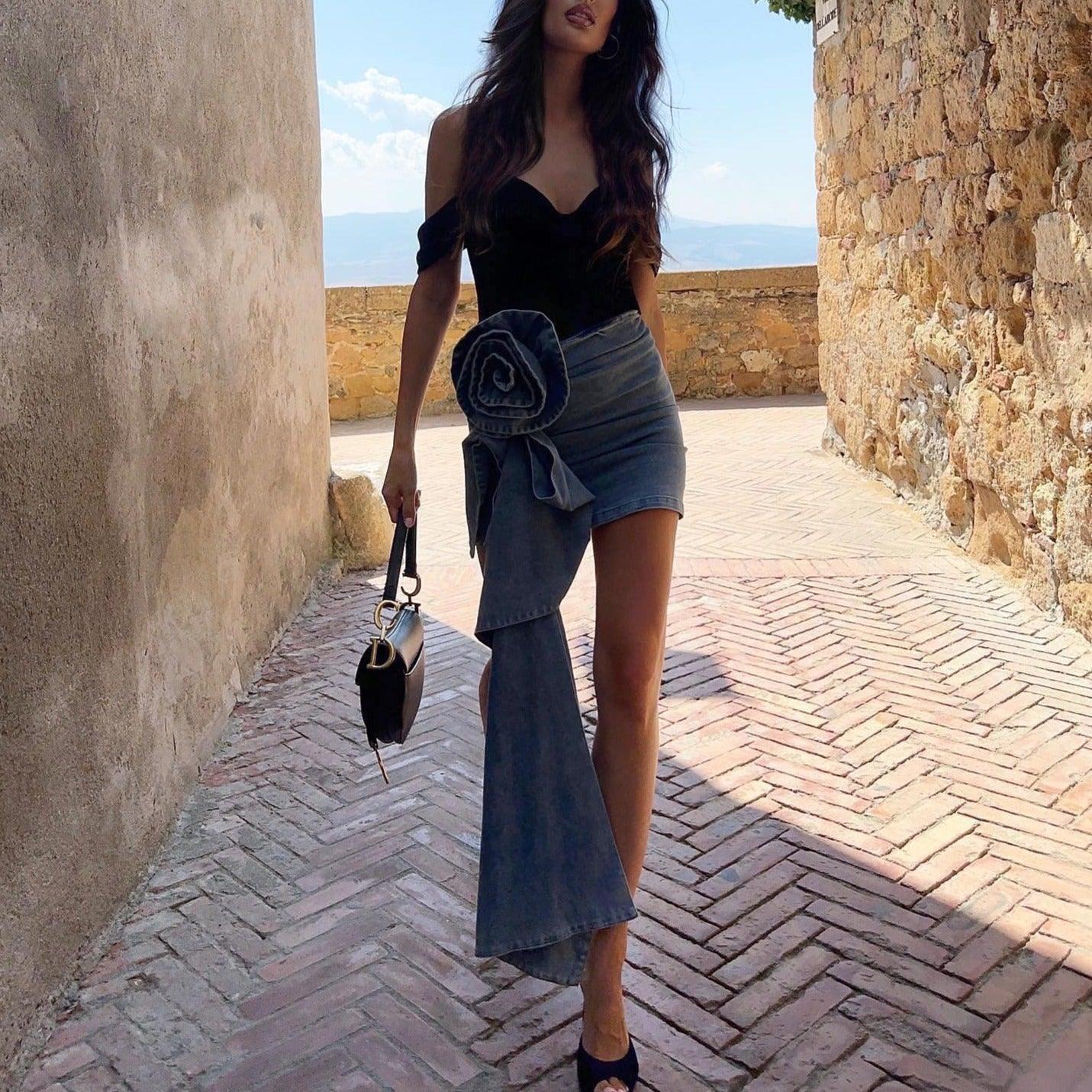 denim mini skirt with oversized floral detail and off-shoulder top, stylish day outfit