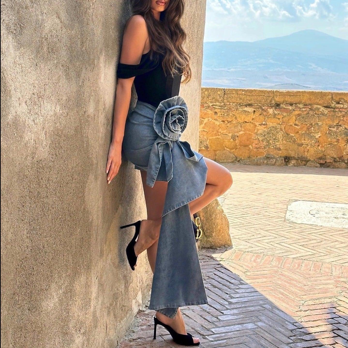 denim wrap skirt with floral detail, paired with off-shoulder top and black stilettos, chic style