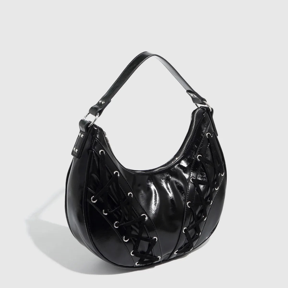 black patent leather handbag with lace-up detailing