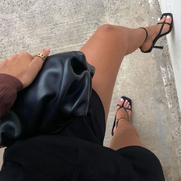 black strappy heels and satin clutch, evening look