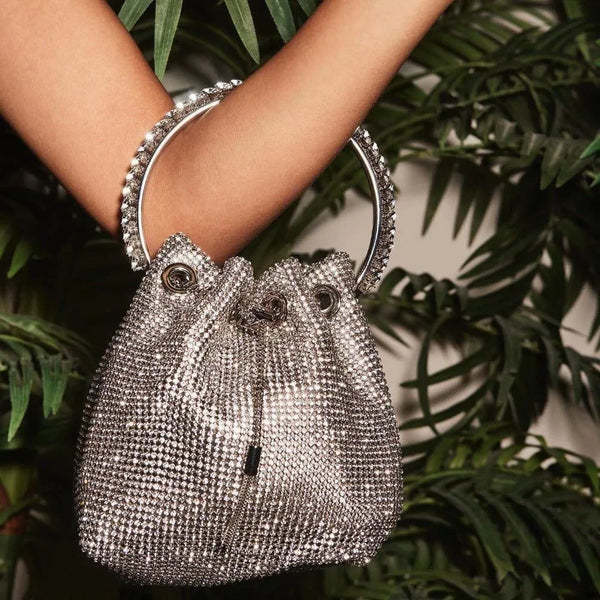 rhinestone-studded drawstring bag with metal handle, evening accessory